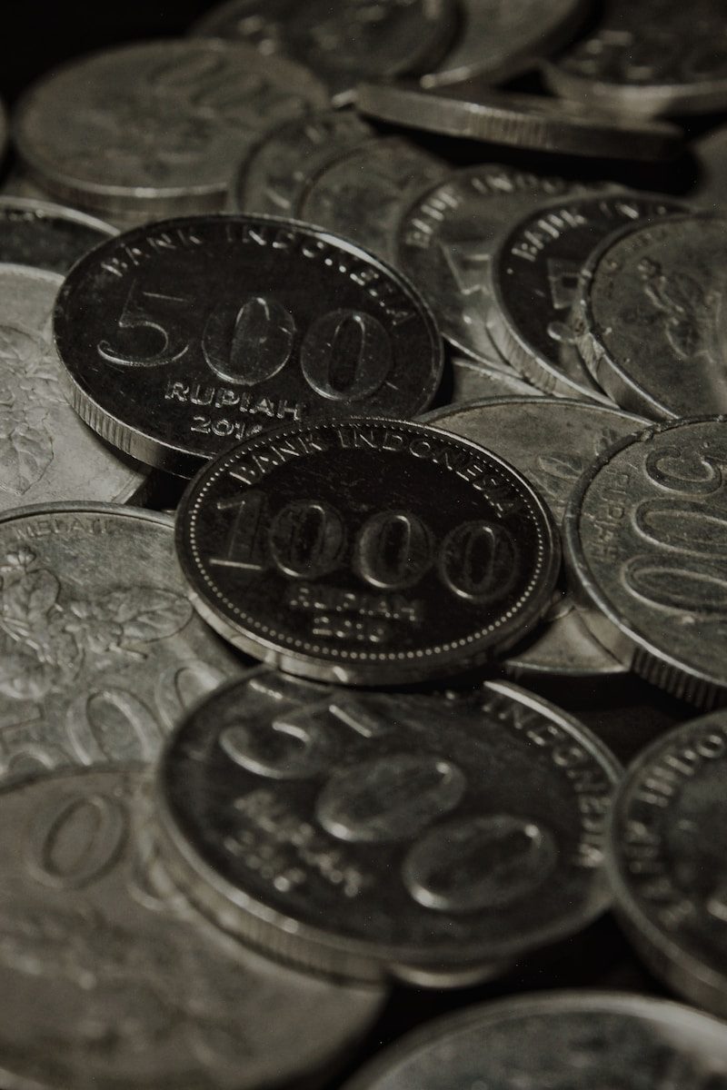 a close up of a pile of coins
