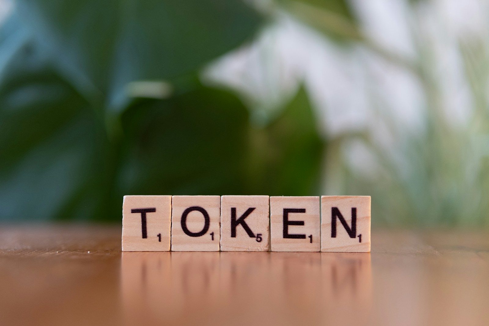A wooden block that says token sitting on a table