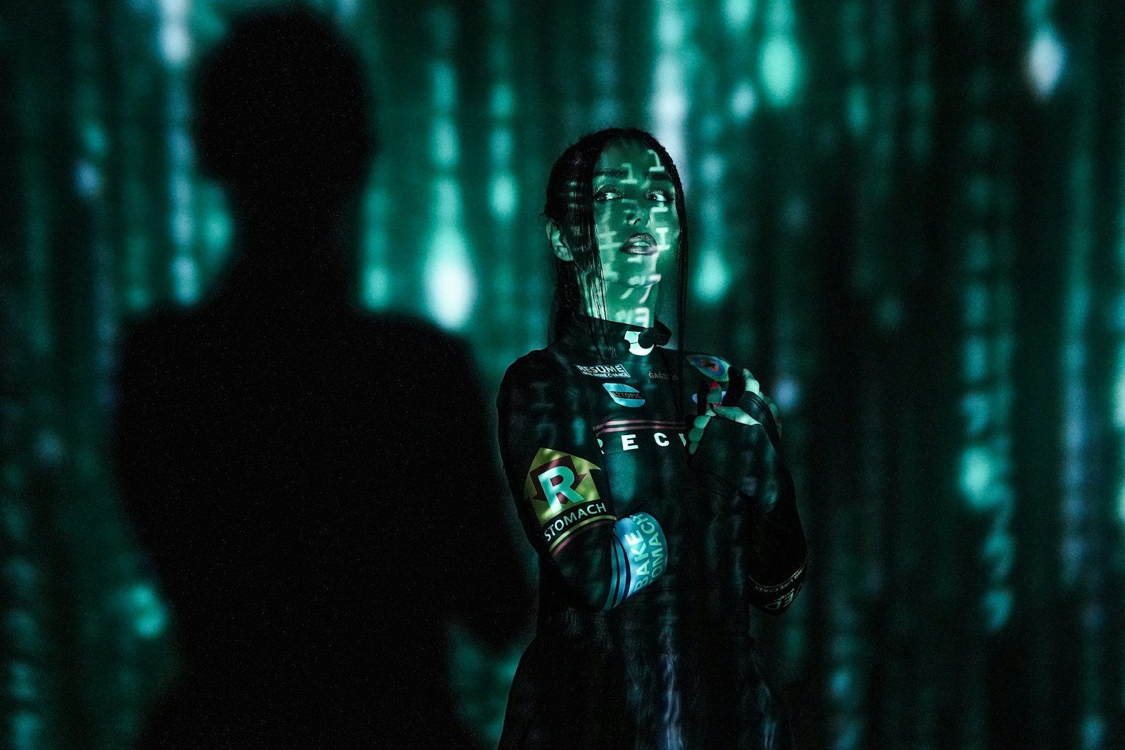 a man standing in front of a green screen