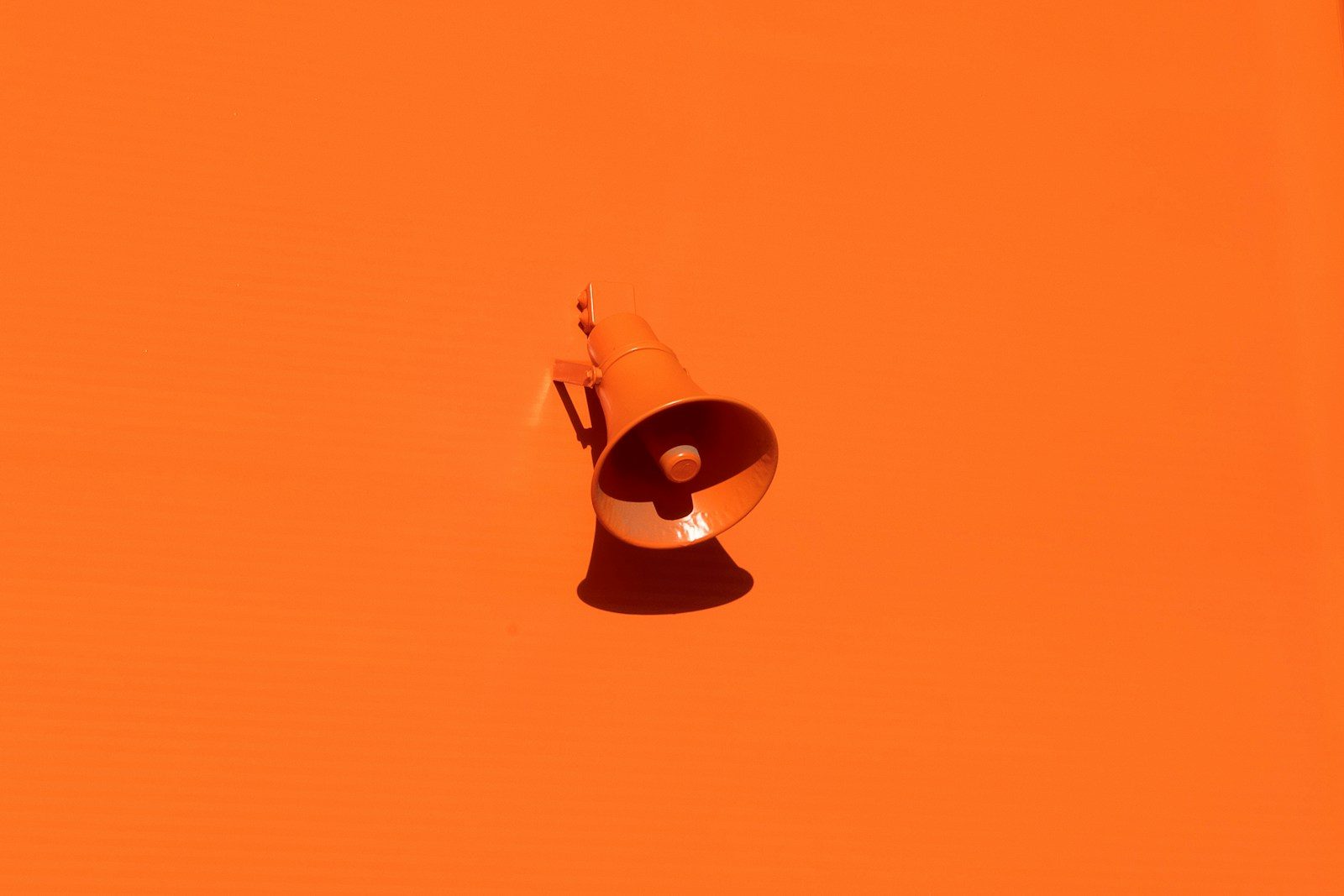orange megaphone on orange wall